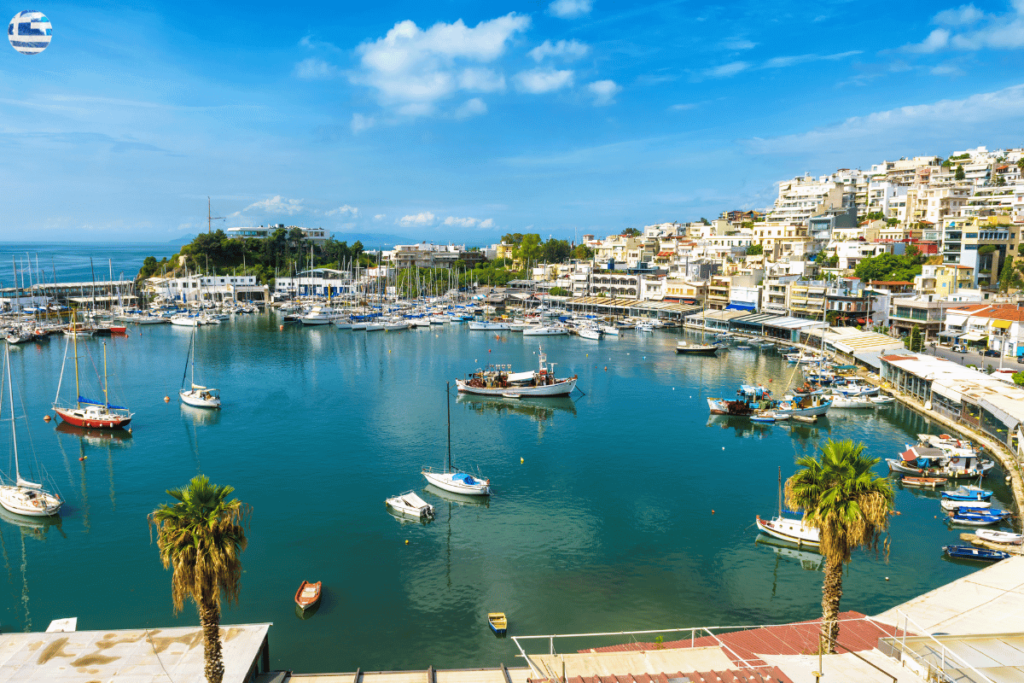 small sea village in Greece with boats in the water 